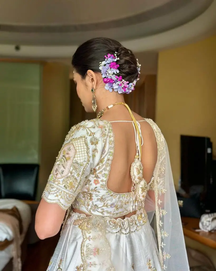 bun hairstyle for saree with flowers 2